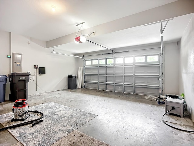 11127 Irish Moss Ave, Riverview, FL 33569 - garage featuring a garage door opener and electric panel