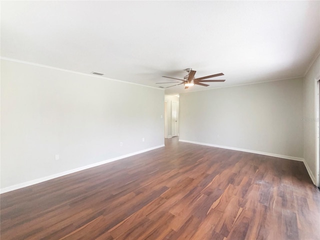 1215 Merlyn St, Lakeland, FL 33813 - unfurnished room featuring dark wood-type flooring, a ceiling fan, and crown molding