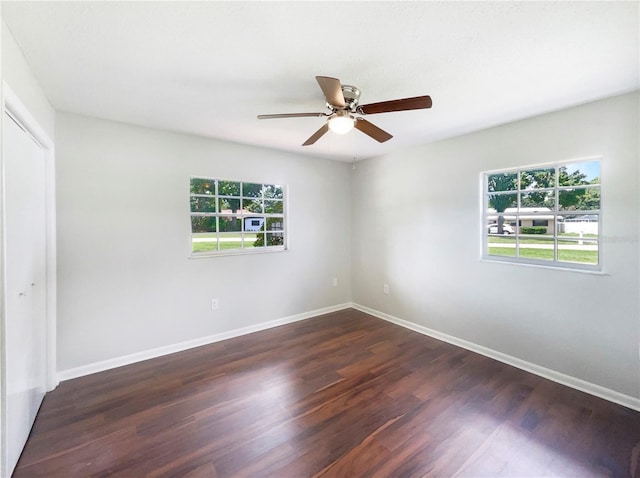 1215 Merlyn St, Lakeland, FL 33813 - unfurnished room featuring dark wood-style floors and ceiling fan