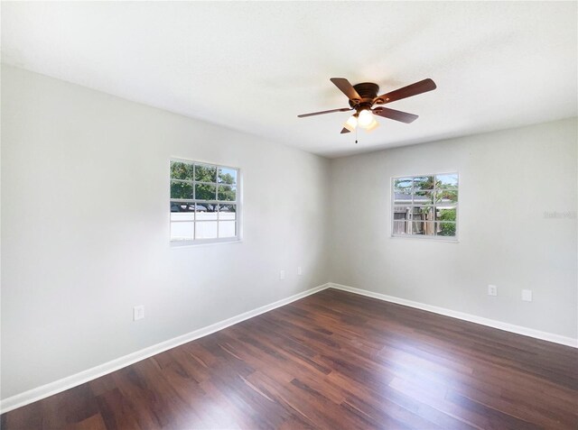 1215 Merlyn St, Lakeland, FL 33813 - empty room featuring dark wood finished floors and a ceiling fan