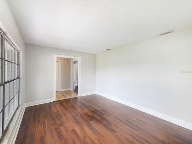 1215 Merlyn St, Lakeland, FL 33813 - unfurnished room featuring wood finished floors and baseboards