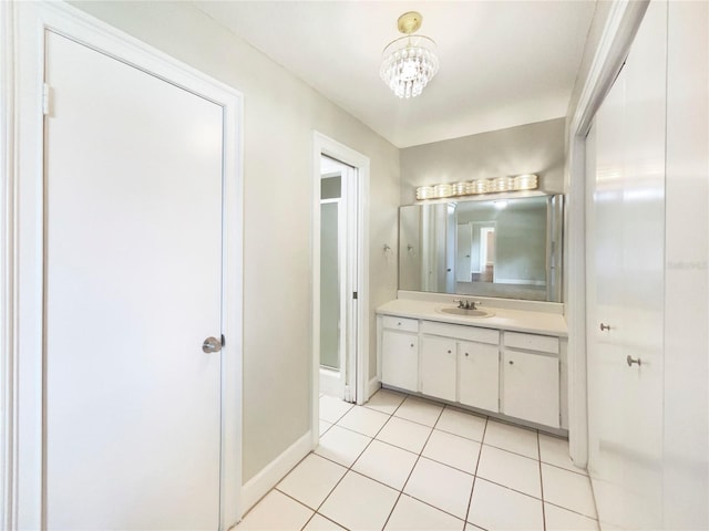 1215 Merlyn St, Lakeland, FL 33813 - full bath with vanity, tile patterned floors, a stall shower, and a chandelier