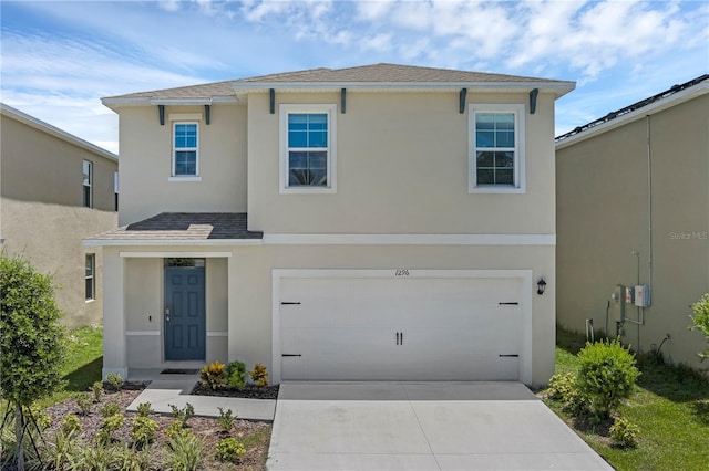 1296 Berry Ln, Davenport, FL 33837 - traditional-style home featuring stucco siding, a garage, concrete driveway, and roof with shingles