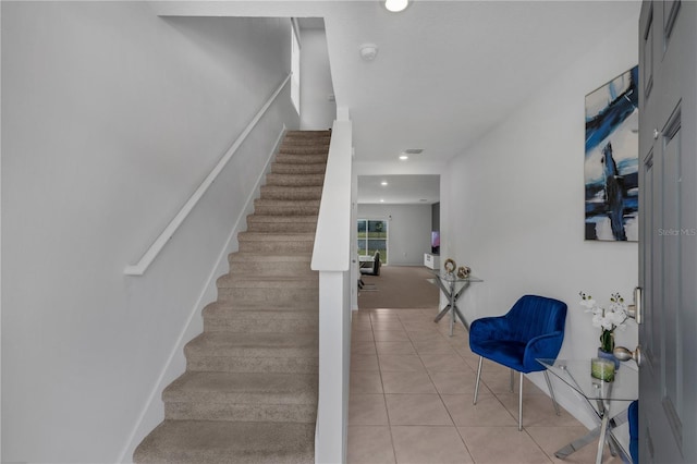 1296 Berry Ln, Davenport, FL 33837 - stairway with tile patterned floors, recessed lighting, and carpet