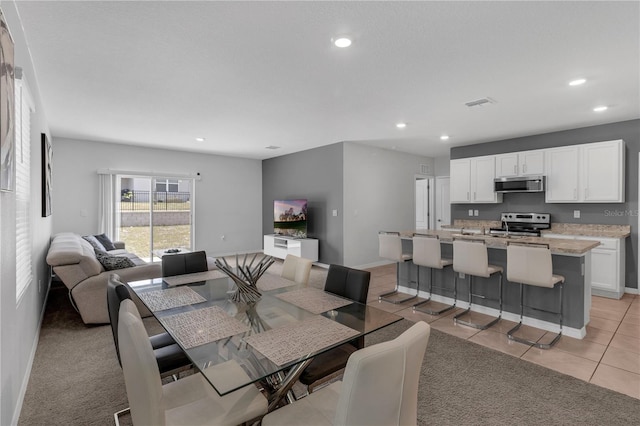 1296 Berry Ln, Davenport, FL 33837 - dining room featuring recessed lighting and light tile patterned flooring