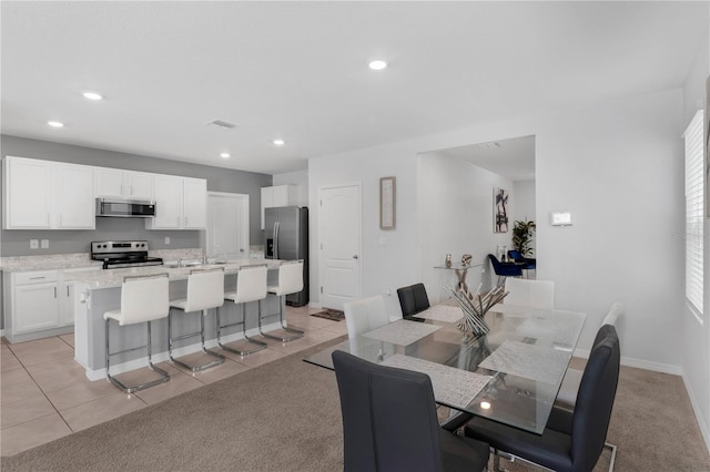 1296 Berry Ln, Davenport, FL 33837 - dining space with recessed lighting and light tile patterned flooring