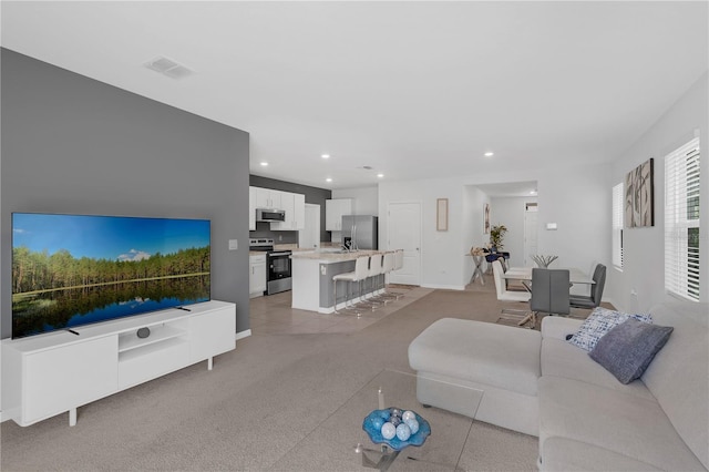 1296 Berry Ln, Davenport, FL 33837 - living area featuring recessed lighting and light carpet