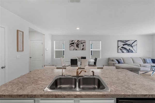 1296 Berry Ln, Davenport, FL 33837 - kitchen featuring open floor plan, light countertops, and recessed lighting