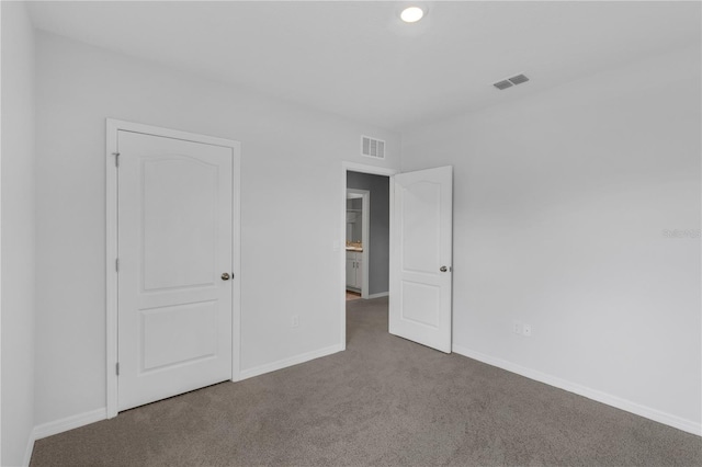1296 Berry Ln, Davenport, FL 33837 - unfurnished bedroom featuring carpet flooring and baseboards