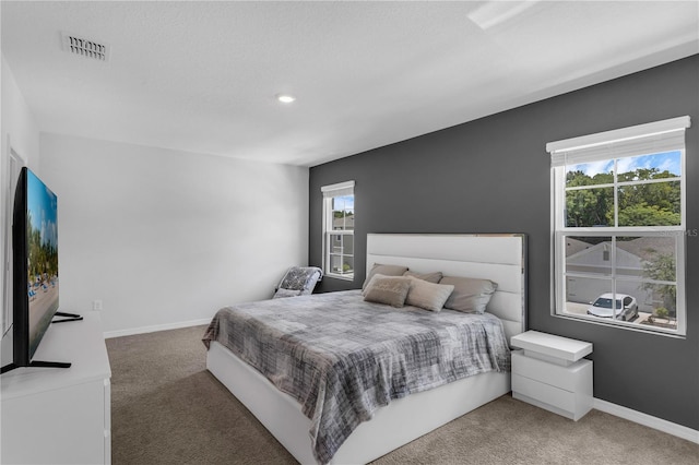 1296 Berry Ln, Davenport, FL 33837 - carpeted bedroom with multiple windows and recessed lighting