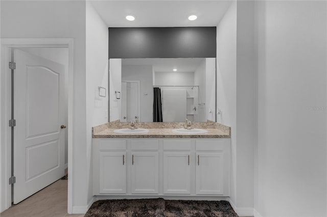 1296 Berry Ln, Davenport, FL 33837 - full bathroom featuring double vanity, tile patterned floors, a shower, and recessed lighting