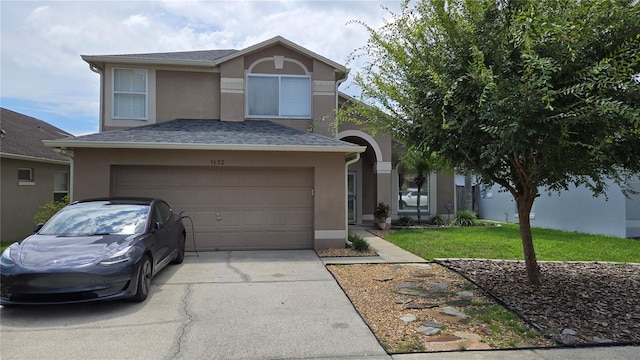 1632 Slash Pine Pl, Oviedo, FL 32765 - view of front of home featuring stucco siding, driveway, a garage, and a front lawn