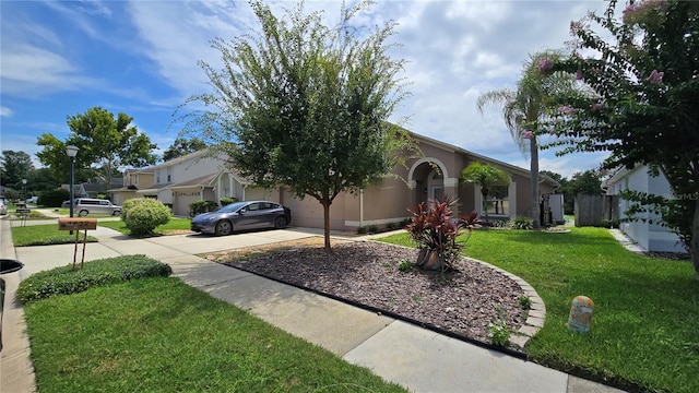 1632 Slash Pine Pl, Oviedo, FL 32765 - obstructed view of property featuring driveway, a garage, and stucco siding