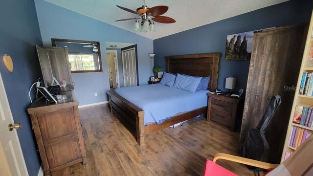 1632 Slash Pine Pl, Oviedo, FL 32765 - bedroom featuring lofted ceiling, wood finished floors, ceiling fan, and a closet