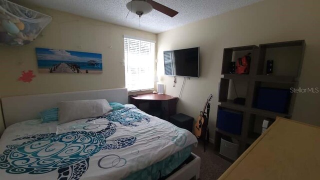 1632 Slash Pine Pl, Oviedo, FL 32765 - bedroom featuring a textured ceiling and ceiling fan