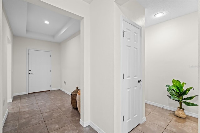 1330 Bucktail Ct, Kissimmee, FL 34746 - foyer featuring tile patterned floors and a tray ceiling