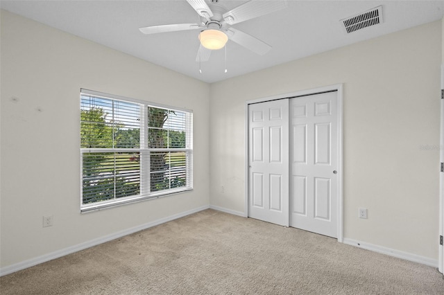1330 Bucktail Ct, Kissimmee, FL 34746 - unfurnished bedroom with carpet floors, a closet, and ceiling fan