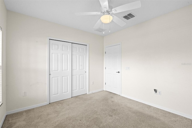 1330 Bucktail Ct, Kissimmee, FL 34746 - unfurnished bedroom with carpet, a closet, and a ceiling fan