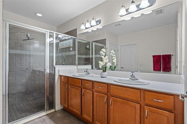 1330 Bucktail Ct, Kissimmee, FL 34746 - full bath featuring tile patterned flooring, double vanity, and a shower stall