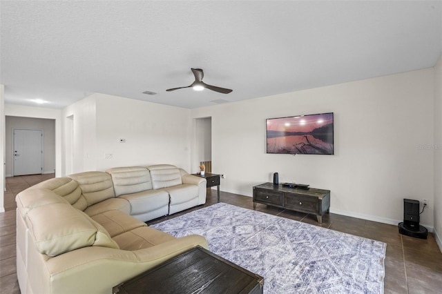 1330 Bucktail Ct, Kissimmee, FL 34746 - tiled living area with ceiling fan and baseboards