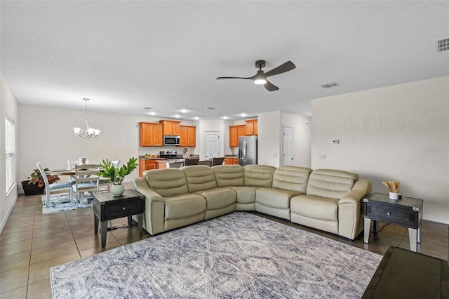 1330 Bucktail Ct, Kissimmee, FL 34746 - tiled living area with a chandelier and a ceiling fan