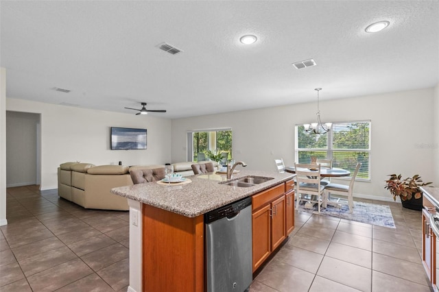 1330 Bucktail Ct, Kissimmee, FL 34746 - kitchen featuring dishwasher, an island with sink, a chandelier, brown cabinets, and light tile patterned flooring