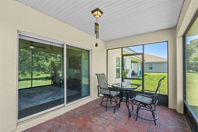 1330 Bucktail Ct, Kissimmee, FL 34746 - sunroom featuring outdoor dining area and a ceiling fan