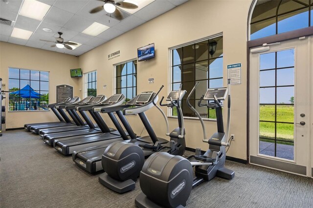 1330 Bucktail Ct, Kissimmee, FL 34746 - exercise room featuring ceiling fan, carpet flooring, a drop ceiling, and a high ceiling