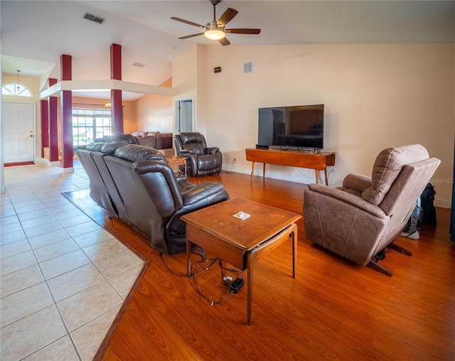 6420 Addax Ave, Cocoa, FL 32927 - living room featuring ceiling fan, vaulted ceiling, and light tile patterned flooring