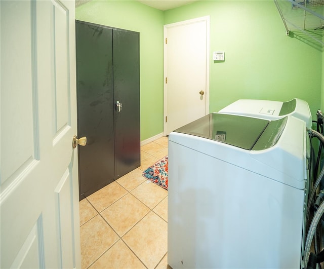 6420 Addax Ave, Cocoa, FL 32927 - laundry room featuring washer and clothes dryer and light tile patterned flooring