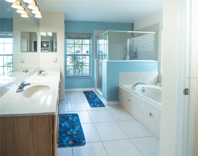 6420 Addax Ave, Cocoa, FL 32927 - bathroom with tile patterned flooring, a bath, double vanity, and a stall shower