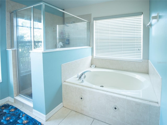 6420 Addax Ave, Cocoa, FL 32927 - bathroom featuring a stall shower, a bath, and tile patterned flooring