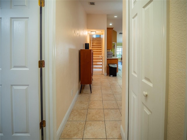6420 Addax Ave, Cocoa, FL 32927 - hallway with light tile patterned floors and recessed lighting