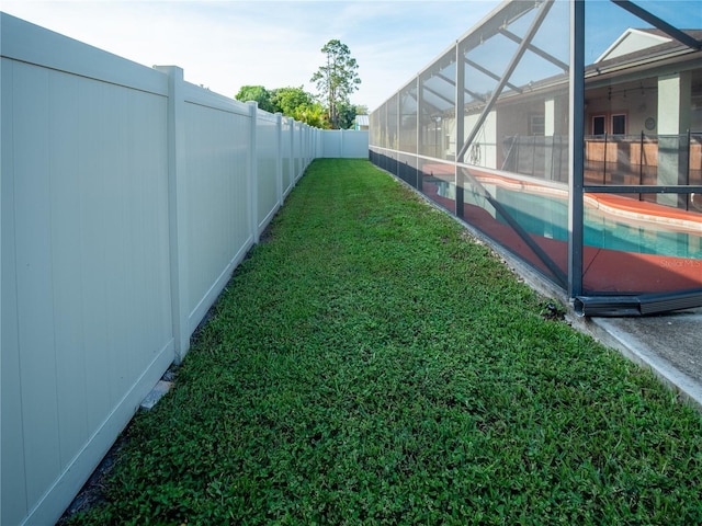 6420 Addax Ave, Cocoa, FL 32927 - fenced backyard featuring an outdoor pool and glass enclosure