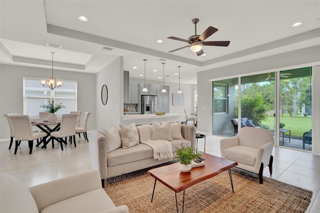 470 Briarbrook Way, Deland, FL 32724 - living area with a raised ceiling, light tile patterned flooring, a chandelier, a ceiling fan, and recessed lighting