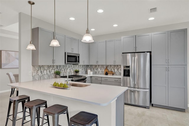 470 Briarbrook Way, Deland, FL 32724 - kitchen with stainless steel appliances, a peninsula, light countertops, a breakfast bar, and decorative backsplash