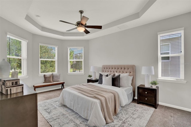 470 Briarbrook Way, Deland, FL 32724 - carpeted bedroom featuring a raised ceiling, multiple windows, and ceiling fan