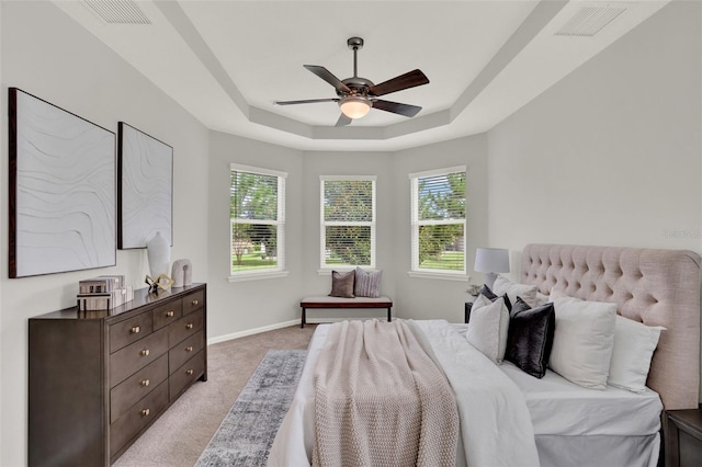 470 Briarbrook Way, Deland, FL 32724 - bedroom with a tray ceiling, light carpet, and ceiling fan