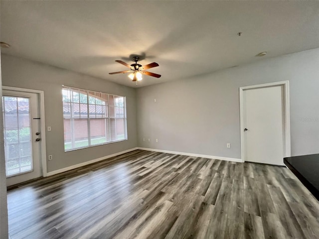 5566 Metrowest Blvd Unit 2-105, Orlando, FL 32811 - unfurnished living room featuring wood finished floors and a ceiling fan
