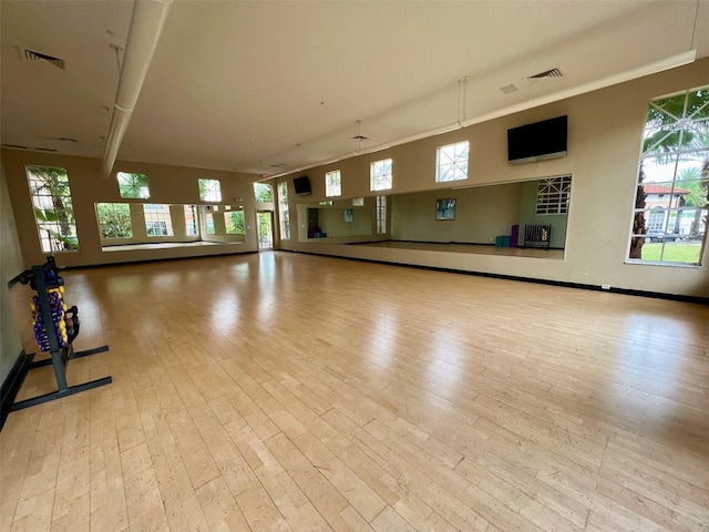 5566 Metrowest Blvd Unit 2-105, Orlando, FL 32811 - exercise area featuring hardwood / wood-style floors and plenty of natural light