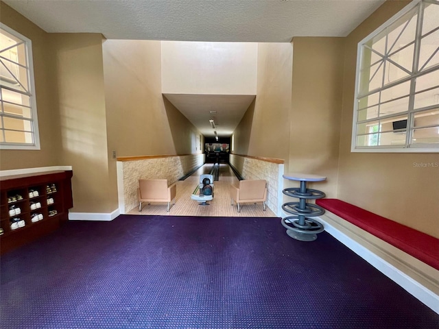 5566 Metrowest Blvd Unit 2-105, Orlando, FL 32811 - foyer featuring baseboards and carpet floors