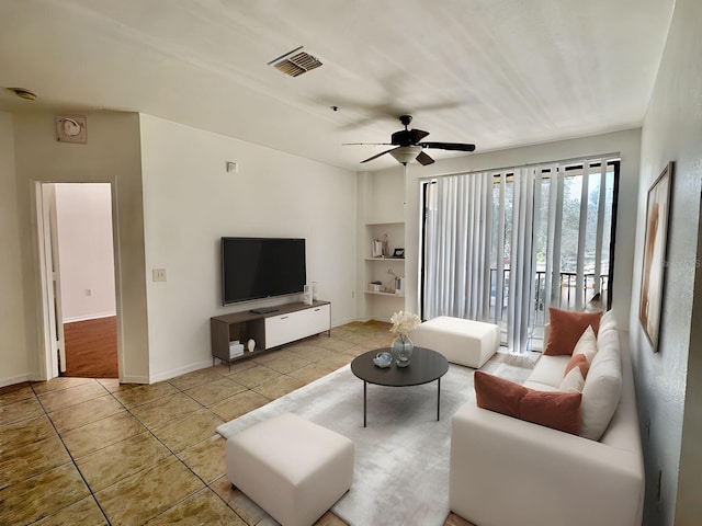 6153 Metrowest Blvd Unit 205, Orlando, FL 32835 - living area featuring tile patterned flooring and a ceiling fan