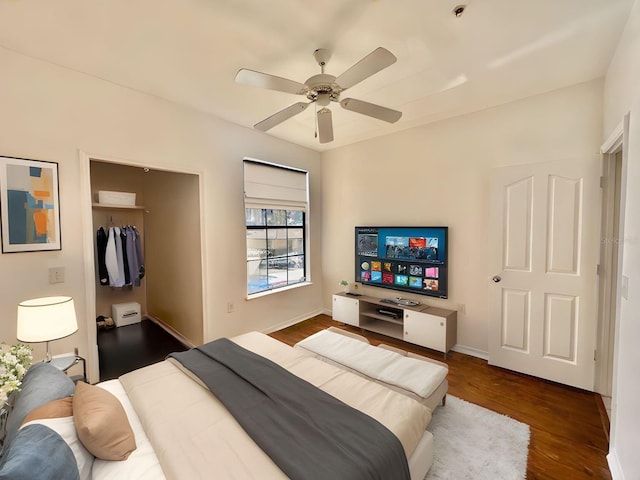6153 Metrowest Blvd Unit 205, Orlando, FL 32835 - bedroom with a closet, dark wood finished floors, and ceiling fan