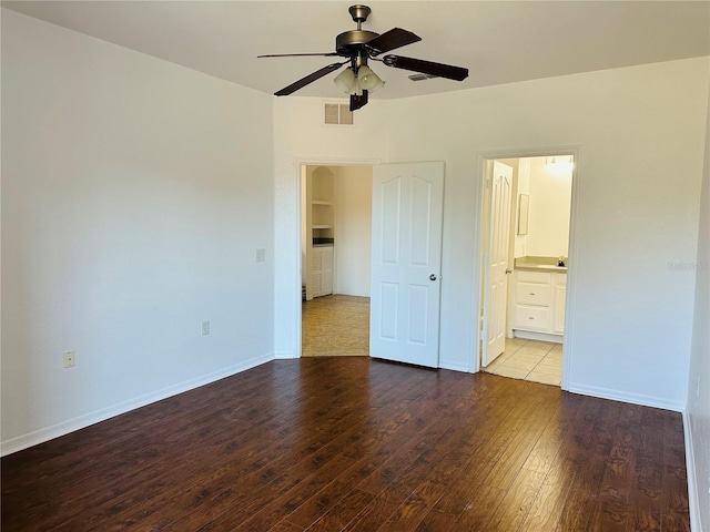 6153 Metrowest Blvd Unit 205, Orlando, FL 32835 - unfurnished bedroom with hardwood / wood-style flooring, connected bathroom, and ceiling fan