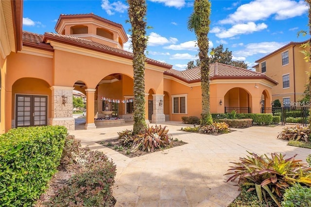 6153 Metrowest Blvd Unit 205, Orlando, FL 32835 - view of front of home with stucco siding and a tile roof