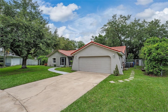 2666 Capp Cir, Kissimmee, FL 34744 - mediterranean / spanish house with a tiled roof, a garage, stucco siding, and concrete driveway