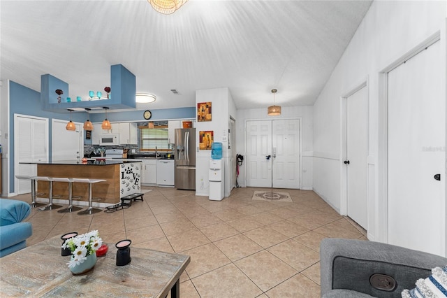 2666 Capp Cir, Kissimmee, FL 34744 - living room featuring light tile patterned flooring