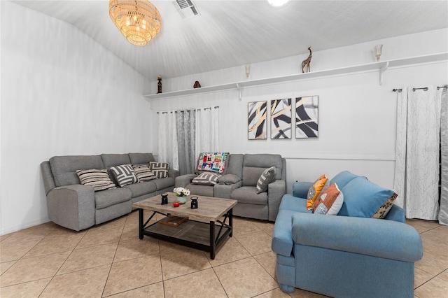 2666 Capp Cir, Kissimmee, FL 34744 - living room with tile patterned floors and a chandelier