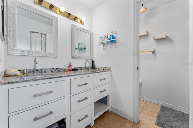 2666 Capp Cir, Kissimmee, FL 34744 - bathroom featuring double vanity and tile patterned floors