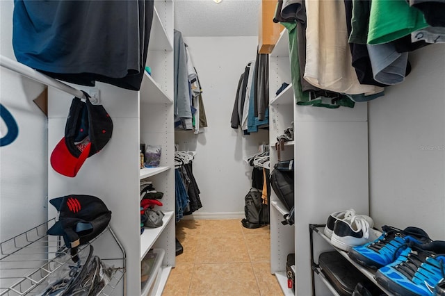 2666 Capp Cir, Kissimmee, FL 34744 - walk in closet featuring light tile patterned flooring